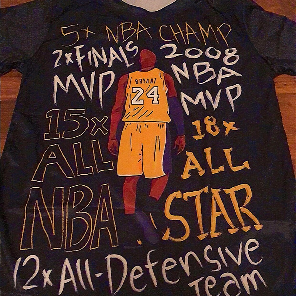 It is a small, black t-shirt that says “Kobe Bryant”